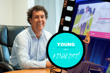 Ross Anderson sits at his desk with overlay of the Young Entrepreneur Awards Night and official finalist badge